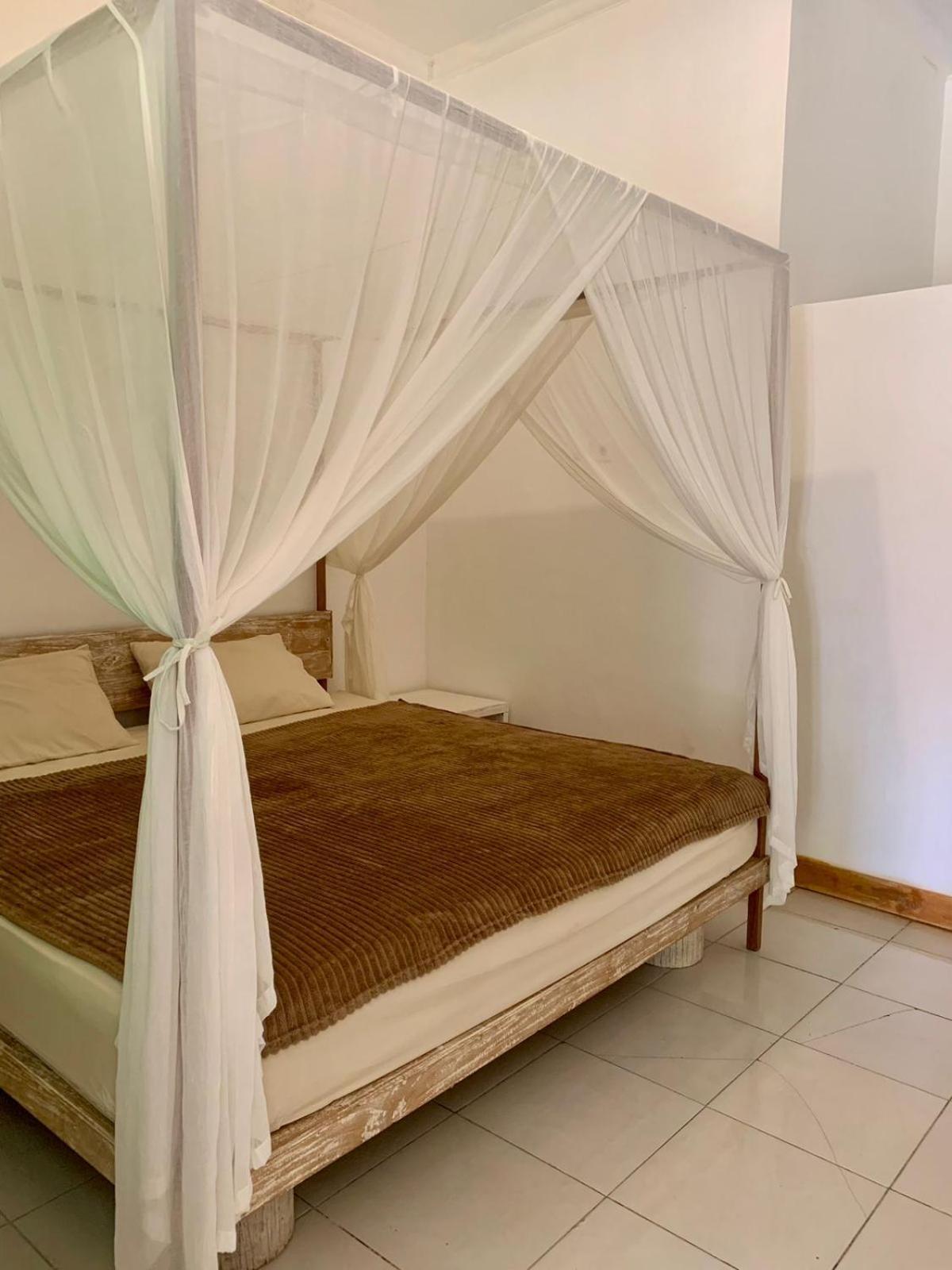 The Village Rua Beach Homestay Exterior photo
