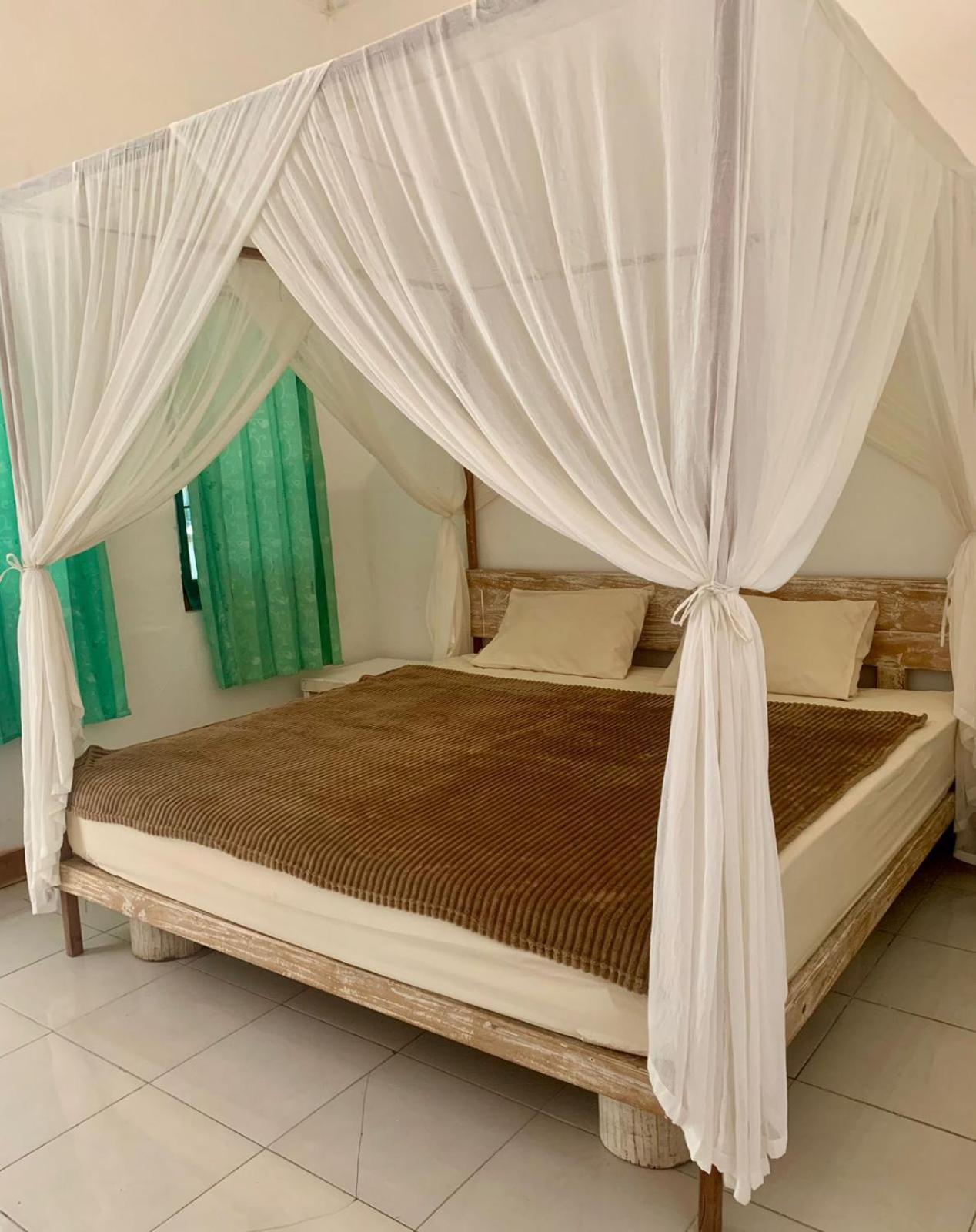 The Village Rua Beach Homestay Exterior photo